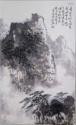 A Chinese scroll depicting a mountainous landscape