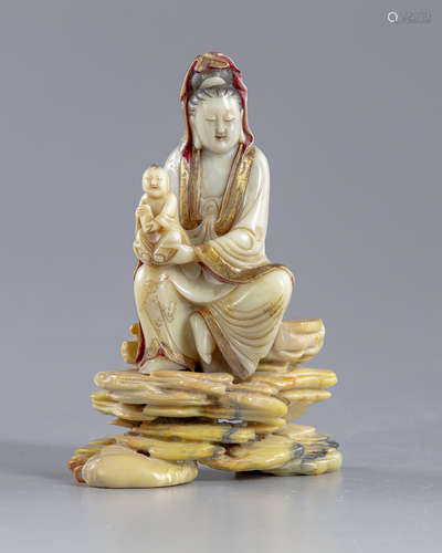 A Chinese soapstone Guanyin figure on stand