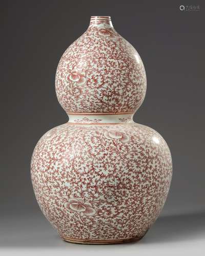 A Chinese iron-red double gourd vase