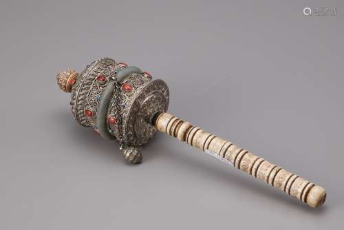 A Tibetan silver prayer mill