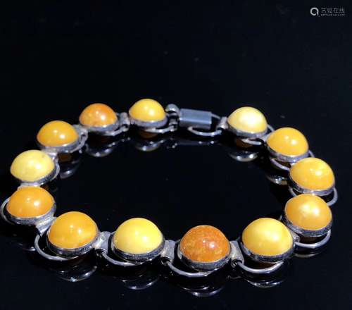 A Chinese Carved Amber and Silver Bracelet