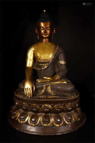 CHINESE PARTLY GILT BRONZE SEATED SAKAYMUNI