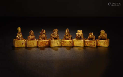 A SET OF NINE NESTING CHINESE GILT BRONZE BEAST SEALS