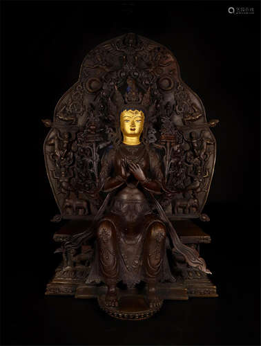 TIBETAN PARTLY GILT BRONZE SEATED TARA ON NICHE