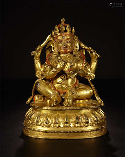 TIBETAN GILT BRONZE SEATED BUDDHIST GUARDIAN