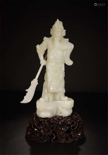 CHINESE WHITE JADE STANDING WARRIOR ON ROSEWOOD STAND