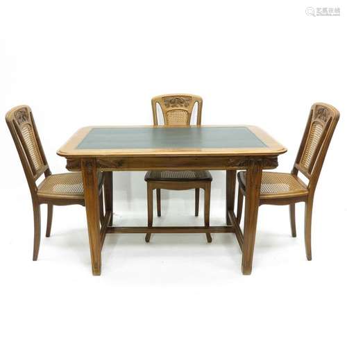 An Art Nouveau Table with Three Chairs