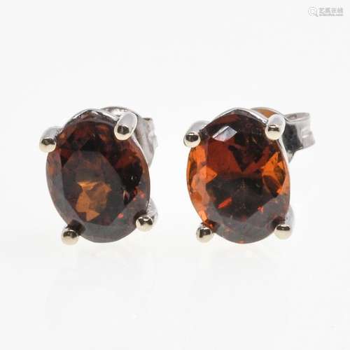 A Pair of 18KG Garnet Earrings