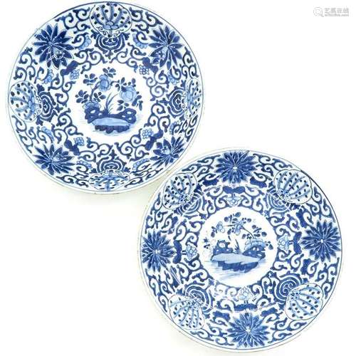 Two Blue and White Decor Chargers