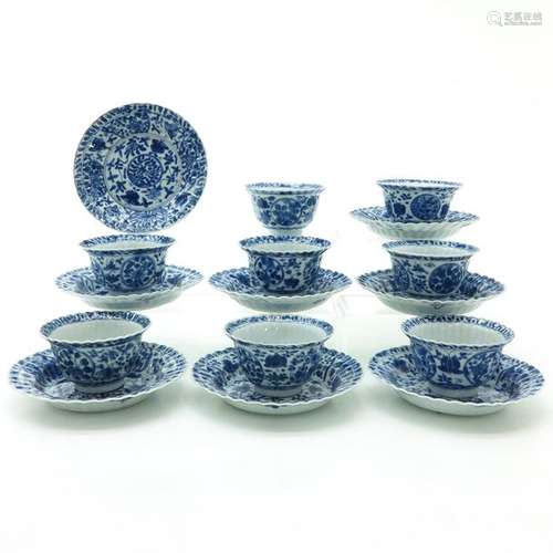 A Set of Eight Blue and White Cups and Saucers