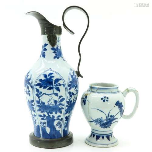 A Blue and White Pitcher and Creamer