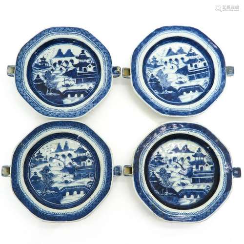 A Series of Four Blue and White Plate Warmers