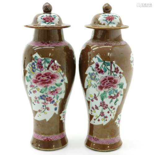 A Pair of Garniture Vases with Covers