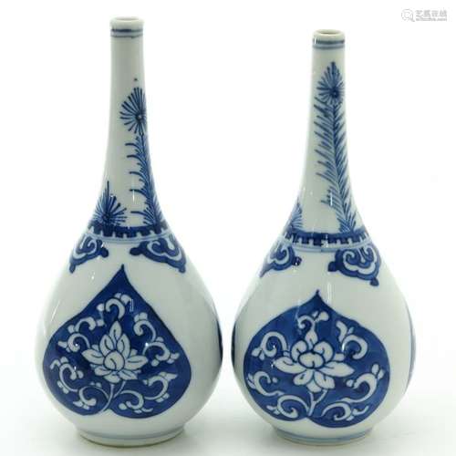 A Pair of Blue and White Bud Vases