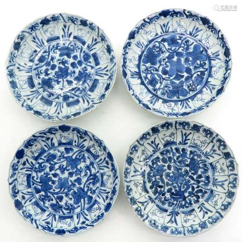 A Series of Four Blue and White Decor Plates