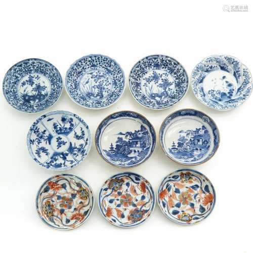 Ten Small Blue and White Plates