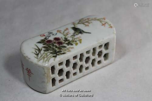 A Chinese rectangular paperweight painted with a bird amidst blossom, 10cm wide.