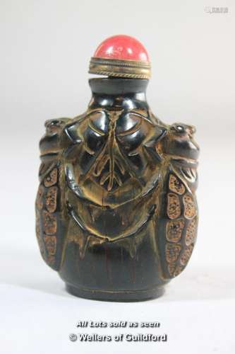 A Chinese horn snuff bottle carved with bees.