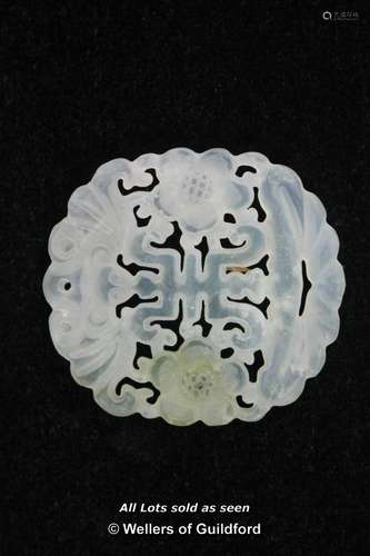 A Chinese translucent hardstone pendant with pierced carving.