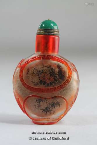 A Chinese snuff bottle interior painted with prunus blossom.