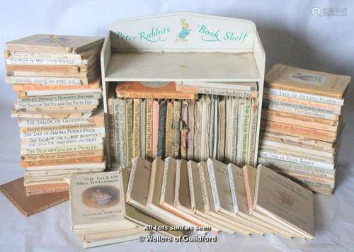 A quantity of Beatrix Potter Peter Rabbit books, including Peter Rabbit bookshelf, many copies