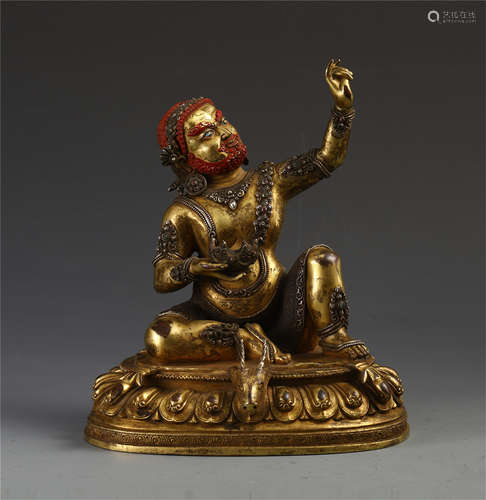 TIBETAN GILT BRONZE SEATED MAHASIDDHA