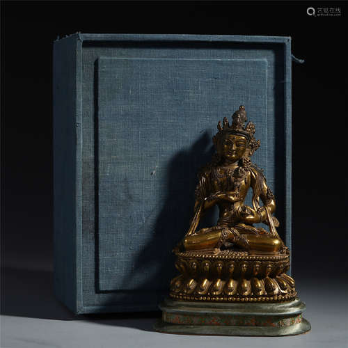 TIBETAN GILT BRONZE SEATED BUDDHIST GUARDIAN