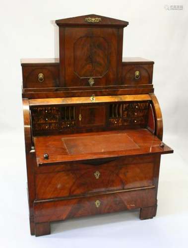 A 19TH CENTURY CONTINENTAL MAHOGANY CYLINDER BUREAU