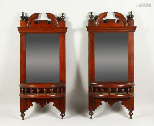 A PAIR OF LATE VICTORIAN WALNUT HALL MIRRORS.  72cms