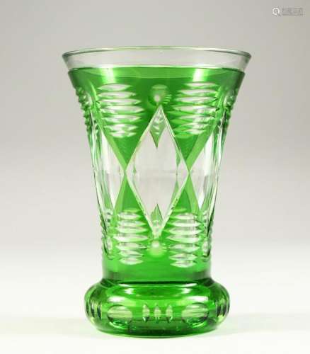 A BOHEMIAN GREEN TINTED THISTLE SHAPED BEAKER-VASE on a