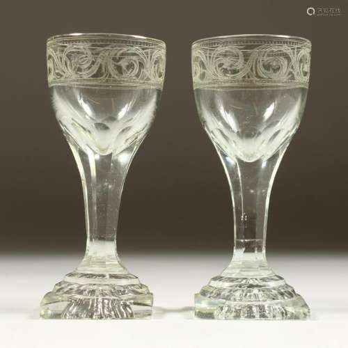 A PAIR OF GEORGIAN ENGRAVED WINE GLASSES on square