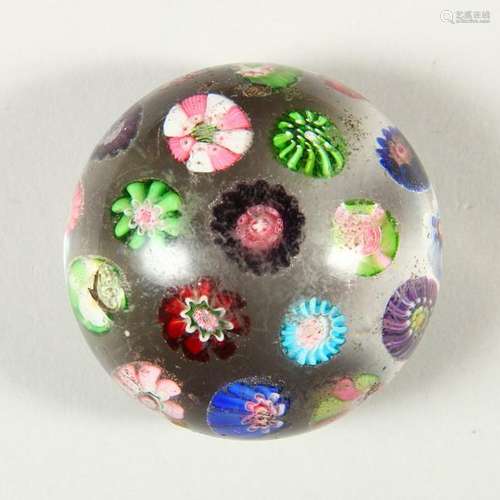 A CLICHY SCATTERED CANE PAPERWEIGHT.  5.5cms diameter.