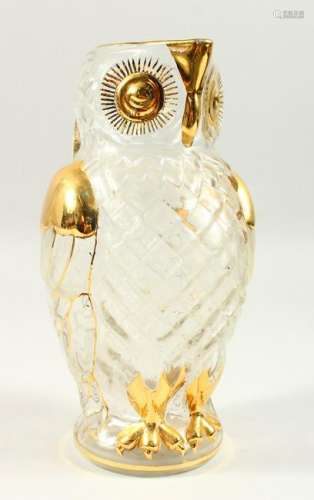 A MOULDED GLASS OWL SHAPE JUG, with gilded decoration.