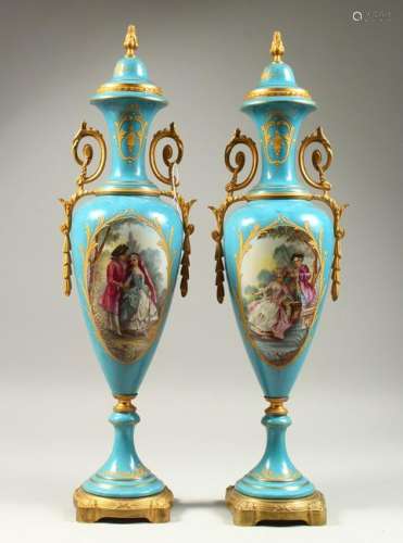A PAIR OF SEVRES STYLE PALE BLUE GROUND SLENDER VASES