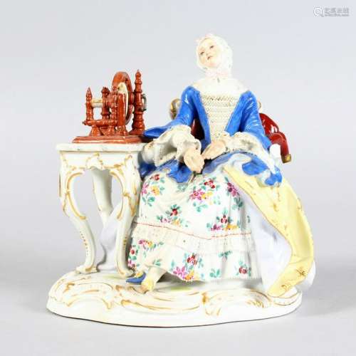 A MEISSEN GROUP OF A LADY, a spinning wheel on a table
