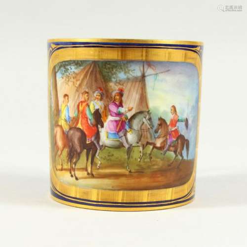 A SEVRES CUP, painted with figures and horses at an