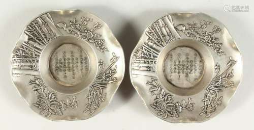 A PAIR OF CAST METAL DISHES, the centre with