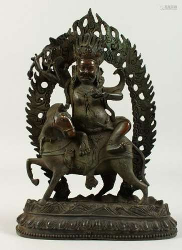 A BRONZE GROUP OF A CHINESE GOD ON A HORSE.  30cms