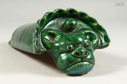 A GREEN GLAZED POTTERY ROOF TILE.  26cms long.