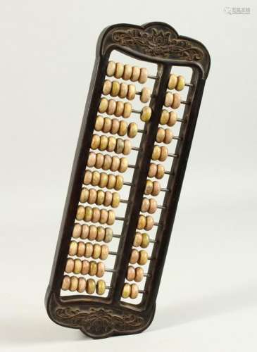 A CHINESE CARVED HARDWOOD ABACUS, with stone beads.