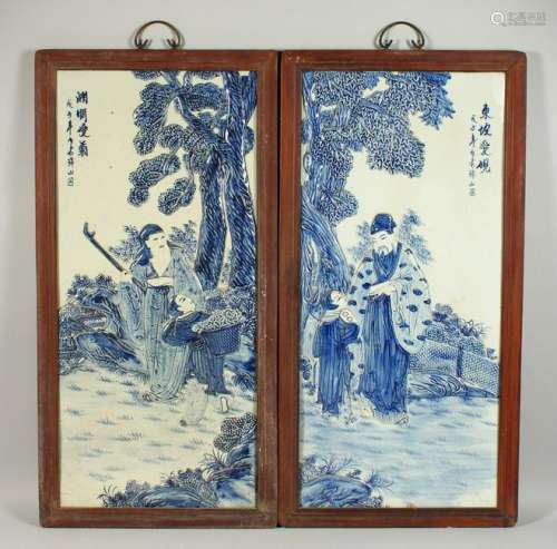 A PAIR OF BLUE AND WHITE PORCELAIN PLAQUES, figures by