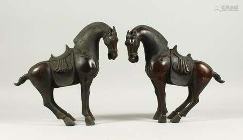 A PAIR OF BRONZE TANG STYE STANDING HORSES.  29cms