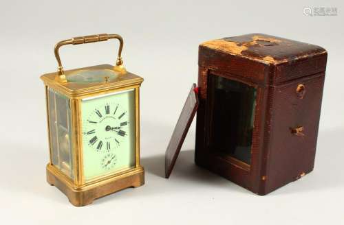 A BRASS CARRIAGE CLOCK, with repeat movement, cream