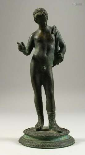 AFTER THE ANTIQUE  A BRONZE STANDING MALE NUDE, on a