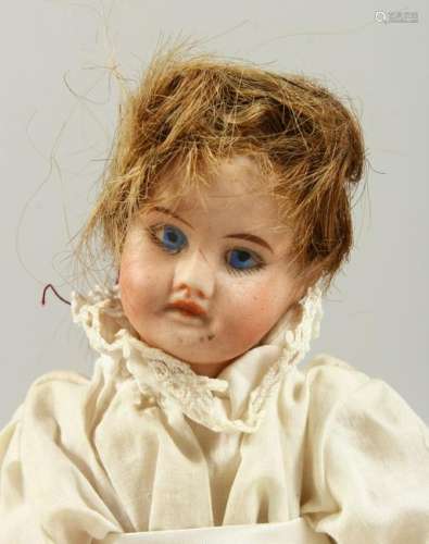 A BISQUE HEADED BABY DOLL, with articulated body.