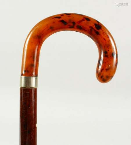A WALKING STICK with faux-tortoiseshell handle and