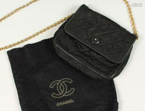 A SMALL BLACK QUILTED SATIN SHOULDER BAG, with gilt