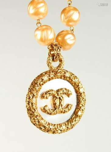 A LARGE PEARL NECKLACE, with Chanel logo pendant, in