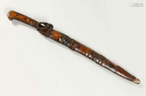AN AFRICAN KNIFE, with horn handle and leather