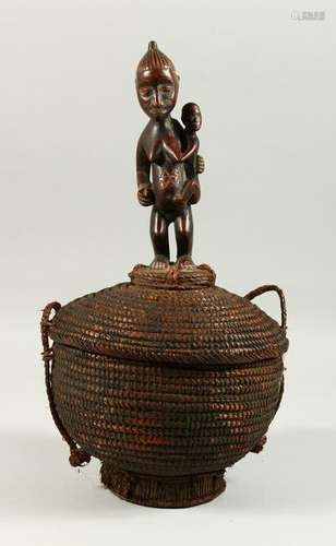 A TRIBAL WOVEN BASKET AND COVER, with carved wood